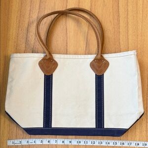 L.L. Bean Cream and Navy Canvas Tote Bag with Molded Leather Handles.